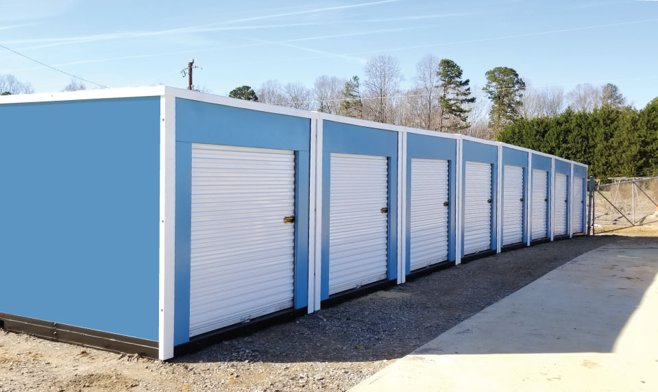 glossy white roll up doors, white roll up storage doors, self storage roll up door colors, storage facility design trends 2026, Boxwell roll up doors, Pantone Color of the Year 2026, Cloud Dancer color, modern self storage design, storage facility branding, white storage doors, outdoor storage unit design, commercial roll up doors, glossy white roll up doors for self storage, best roll up door color for storage facilities, modern storage facility exterior design, white roll up doors for outdoor storage units, self storage color trends 2026, clean storage facility design, minimalist self storage design, premium storage facility look, contemporary self storage exterior