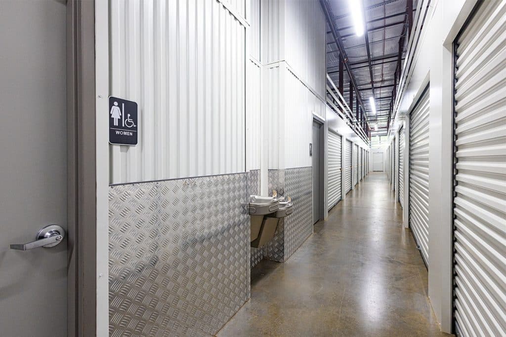 Boxwell hallway system with an integrated bathroom and drinking fountains. Boxwell hallway systems are all steel, ideal for retrofits, new builds, basement storage, and more.