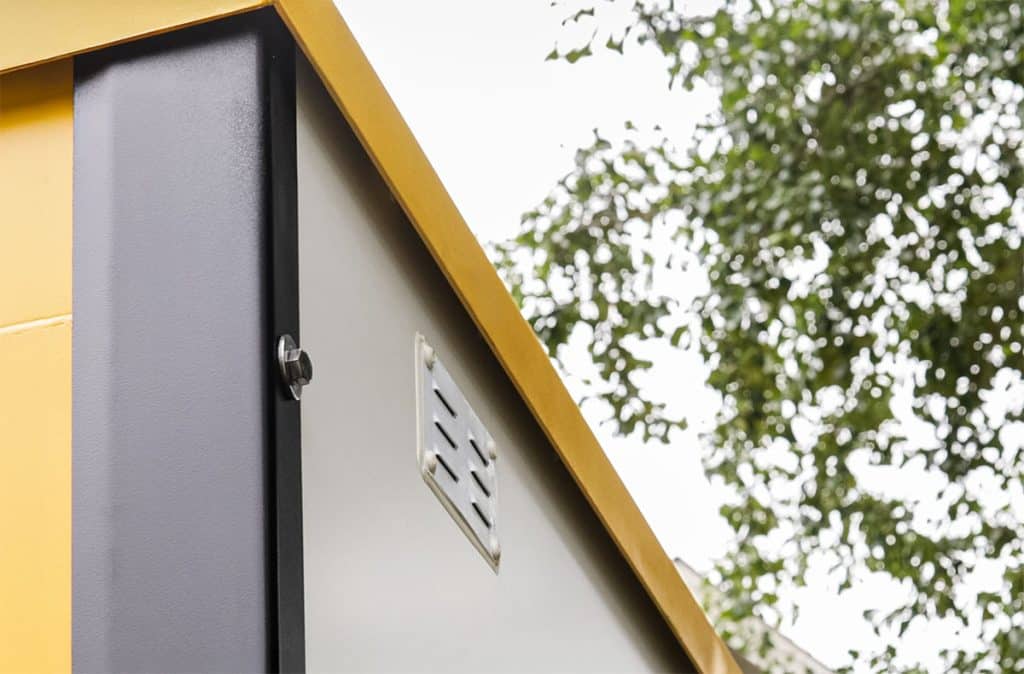 Boxwell roof fits "shoebox" style over walls, guiding water away from the container.
