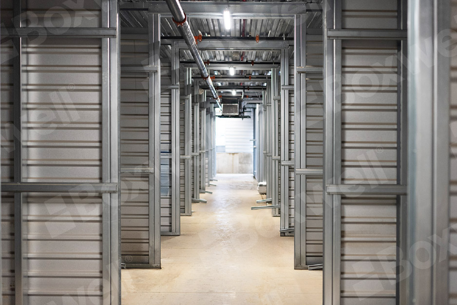 Boxwell hallway storage system featuring durable steel construction, customizable unit sizes, and an efficient layout for self-storage facilities.