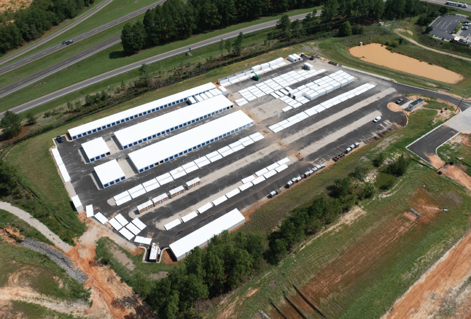 self-storage construction, construction costs, hidden costs, site preparation, grading and drainage, permitting and zoning, construction timelines, labor costs, property tax, relocatable storage units, portable storage, Boxwell units, self-storage development, building efficiency, storage facility expansion, modular storage, steel storage buildings, self-storage budgeting, storage site planning, self-storage investment