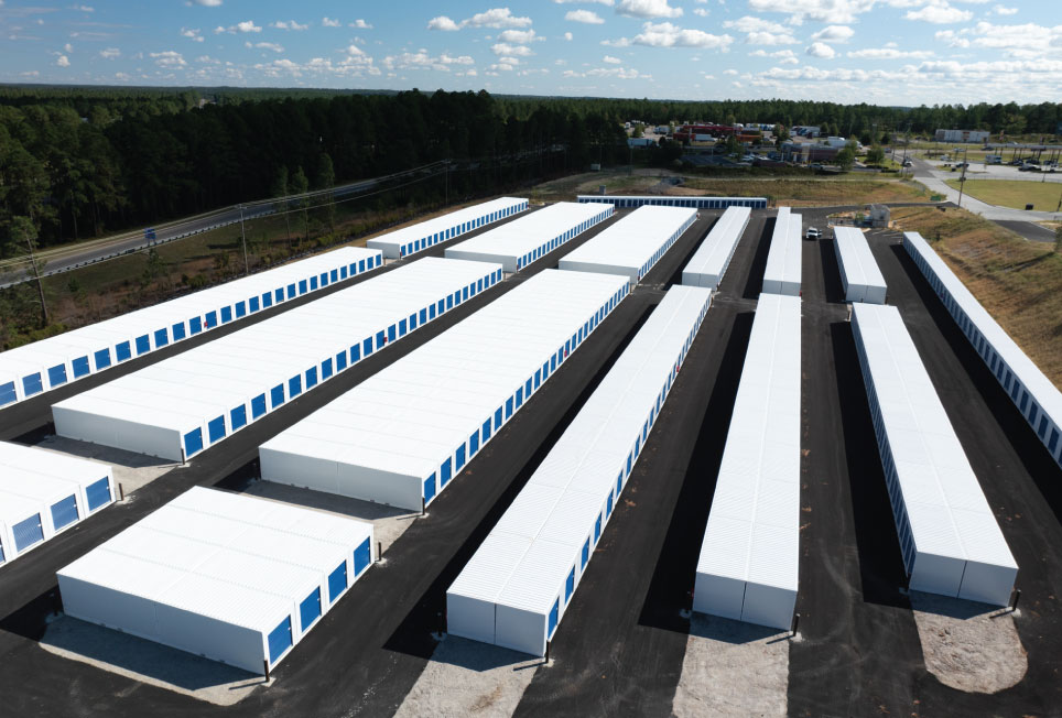 self-storage construction, construction costs, hidden costs, site preparation, grading and drainage, permitting and zoning, construction timelines, labor costs, property tax, relocatable storage units, portable storage, Boxwell units, self-storage development, building efficiency, storage facility expansion, modular storage, steel storage buildings, self-storage budgeting, storage site planning, self-storage investment