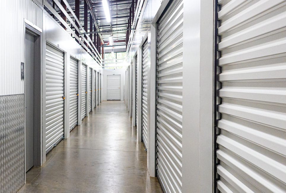 indoor self-storage, climate-controlled storage, climate-controlled self-storage units, indoor self-storage facilities, self-storage hallway systems, self-storage building conversion, warehouse conversion to self-storage, commercial building conversion, adaptive reuse self-storage, indoor storage solutions, self-storage facility design, self-storage development, maximize rentable space, rentable square footage, self-storage unit layout, storage facility planning, self-storage expansion, warehouse self-storage conversion, commercial property redevelopment, secure self-storage, modern self-storage facilities, urban self-storage, self-storage trends, climate-controlled storage demand, indoor storage market, storage facility optimization, self-storage construction alternatives, self-storage operators, Boxwell hallway systems
